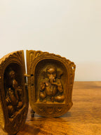 Sandalwood carved god inside shell