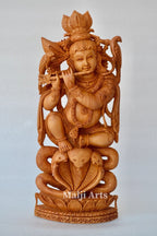 Baby Krishna sitting on snack fine wooden hand carved statue - Arts99 - Online Art Gallery